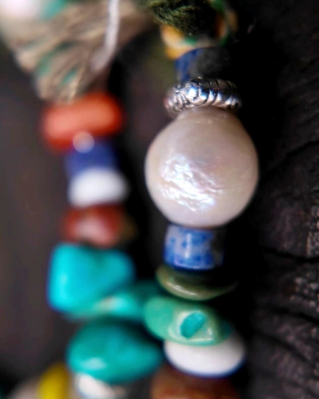 Macro detail of freshwater pearl and Tibetan-style antiqued silver-tone metal beads