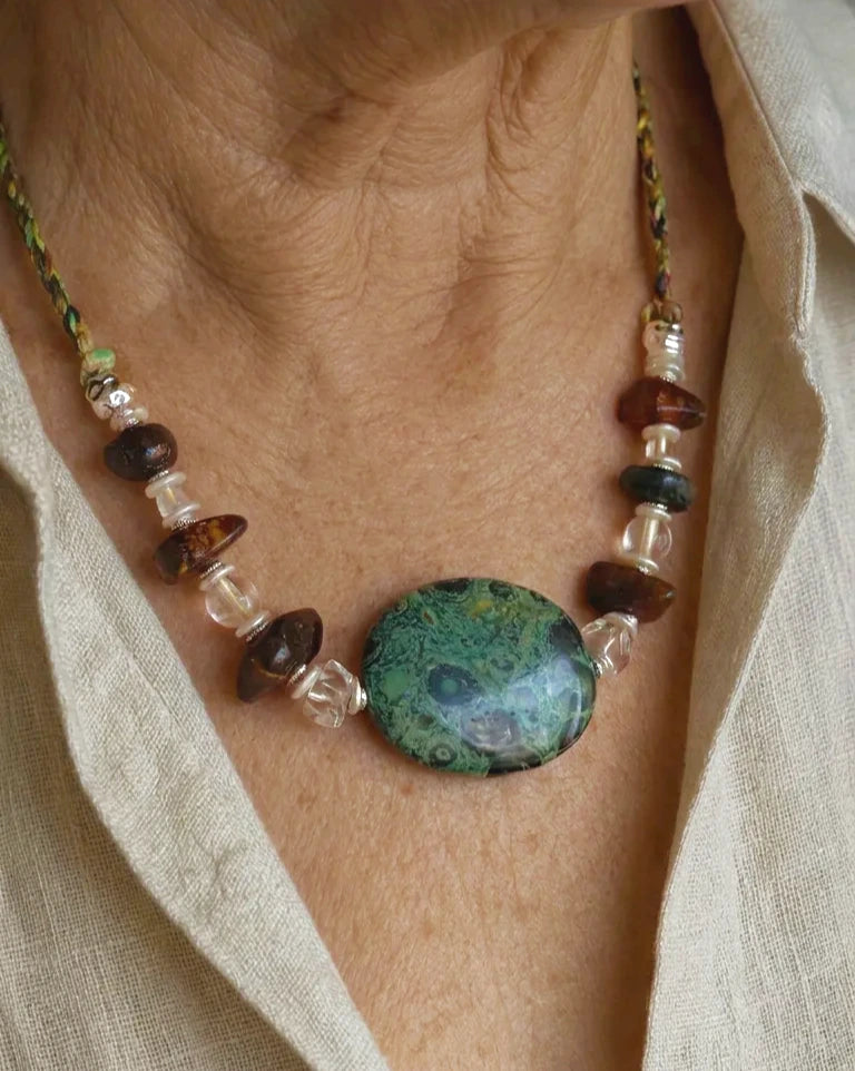 The Grove #45 Kambaba jasper and amber necklace worn with an open linen shirt