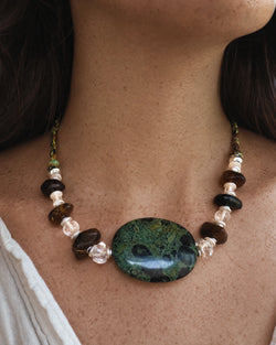 The Grove #45 Kambaba jasper and amber necklace worn with an open linen shirt
