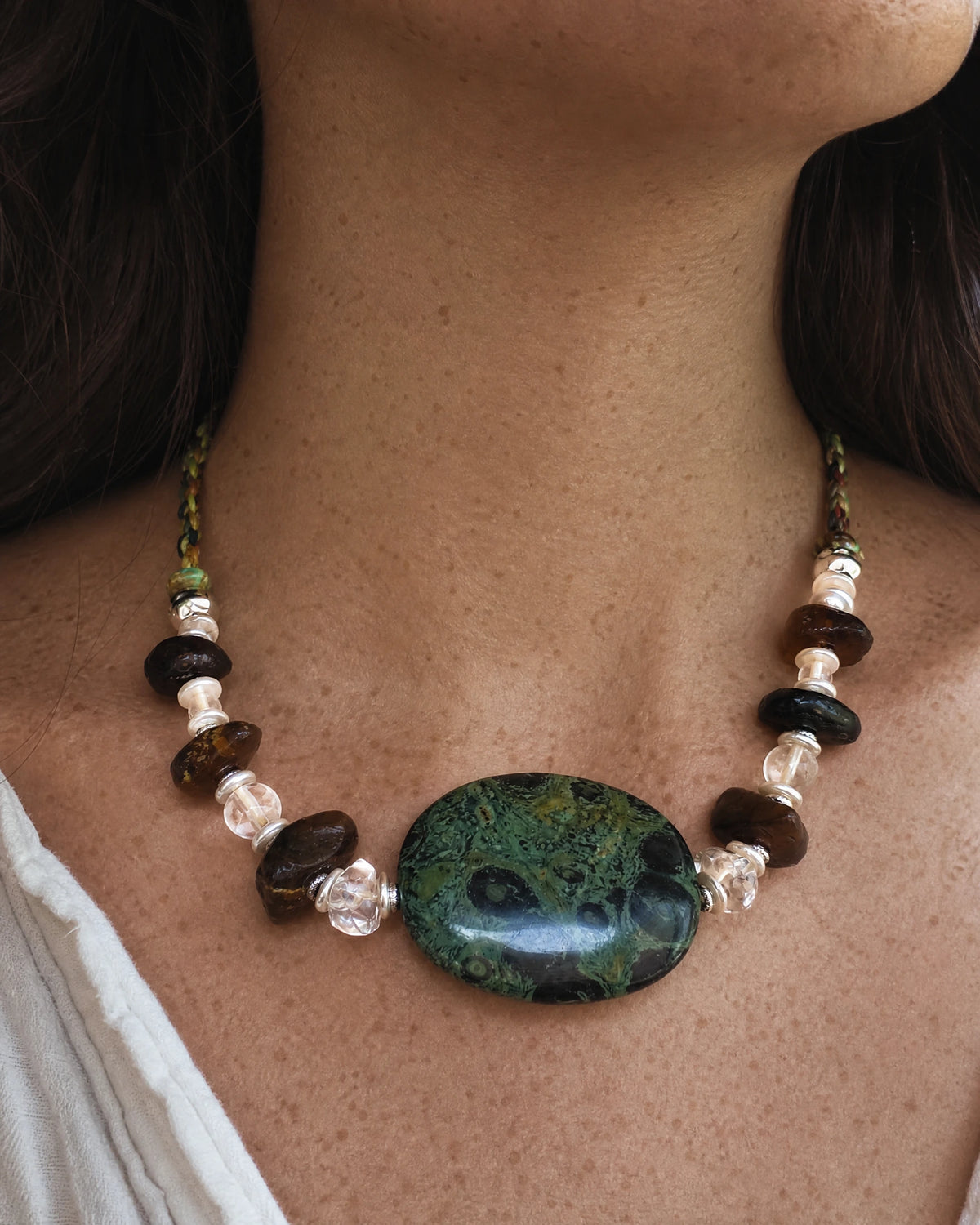 The Grove #45 Kambaba jasper and amber necklace worn with an open linen shirt