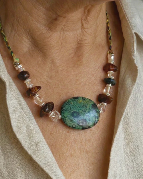The Grove #45 Kambaba jasper and amber necklace worn with an open linen shirt