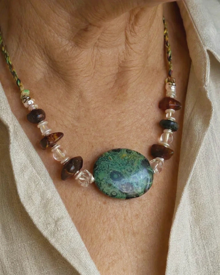 The Grove #45 Kambaba jasper and amber necklace worn with an open linen shirt