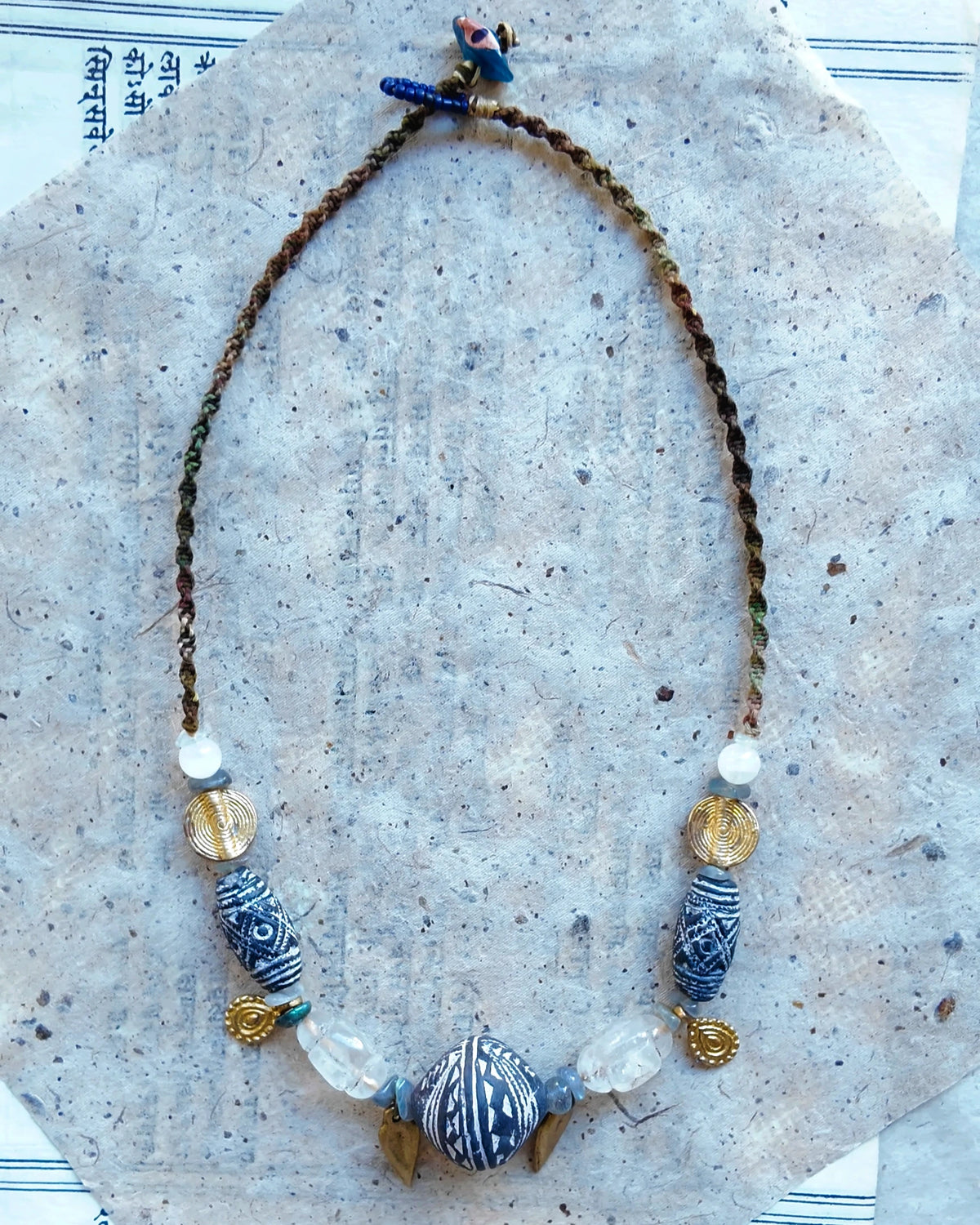 The Inkweave #59: Full necklace in softer light, showing its fixed shape