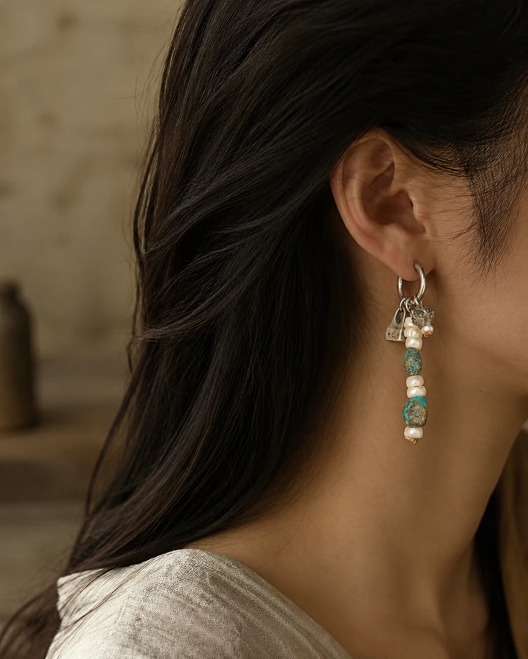 The Littoral #51: Earring worn in profile, showing its drop against the ear and neck