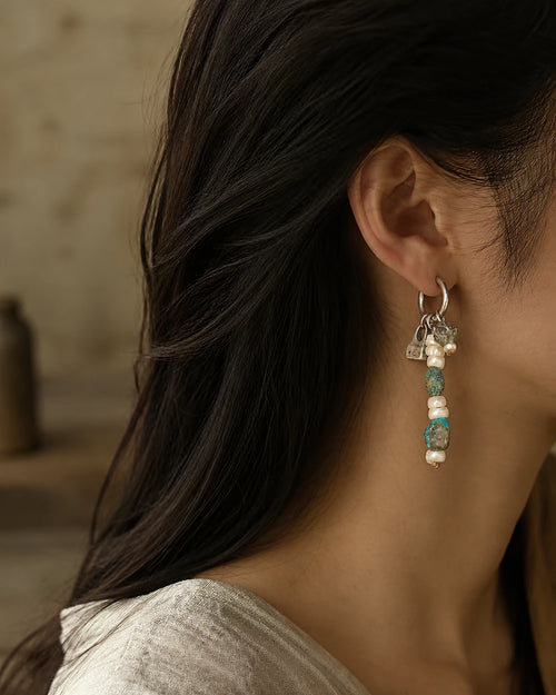 The Littoral #51: Earring worn in profile, showing its drop against the ear and neck