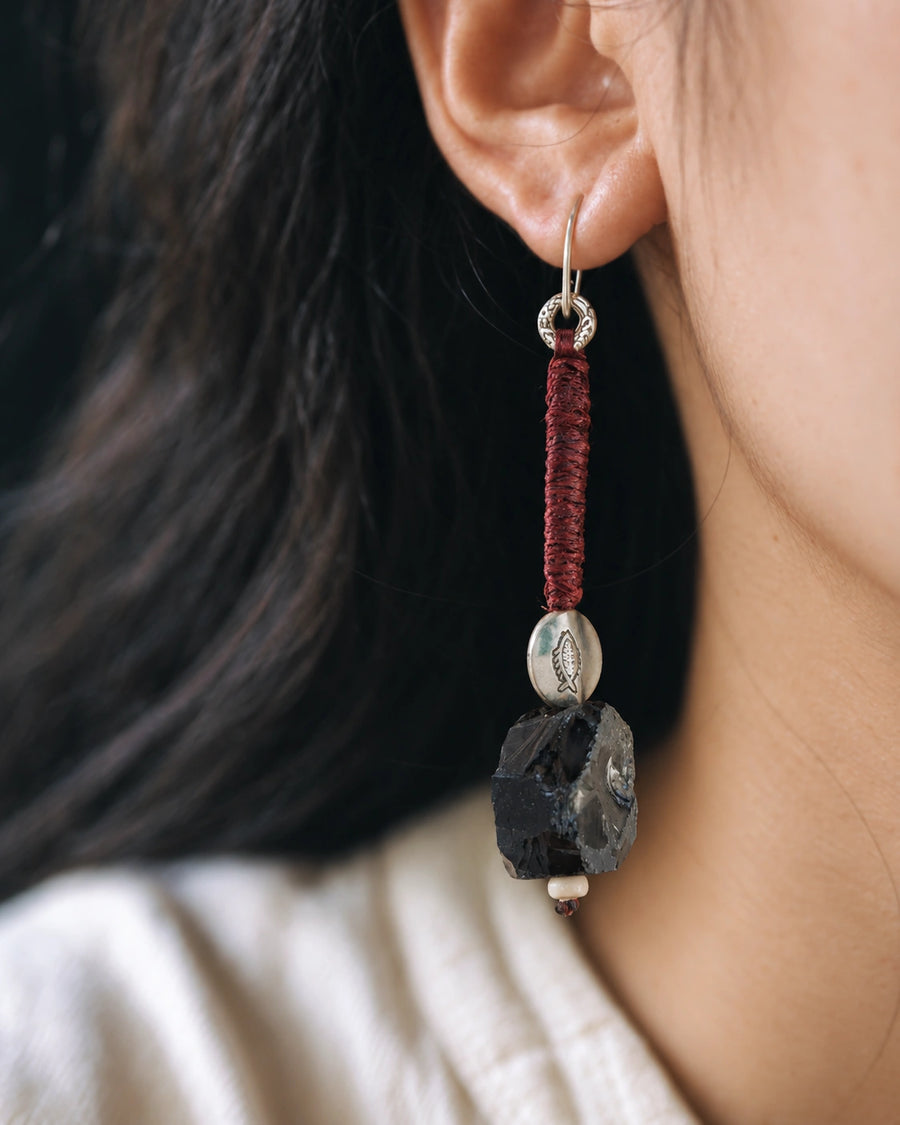 The Nightglass #53: Black obsidian drop earring worn in profile with a white shirt