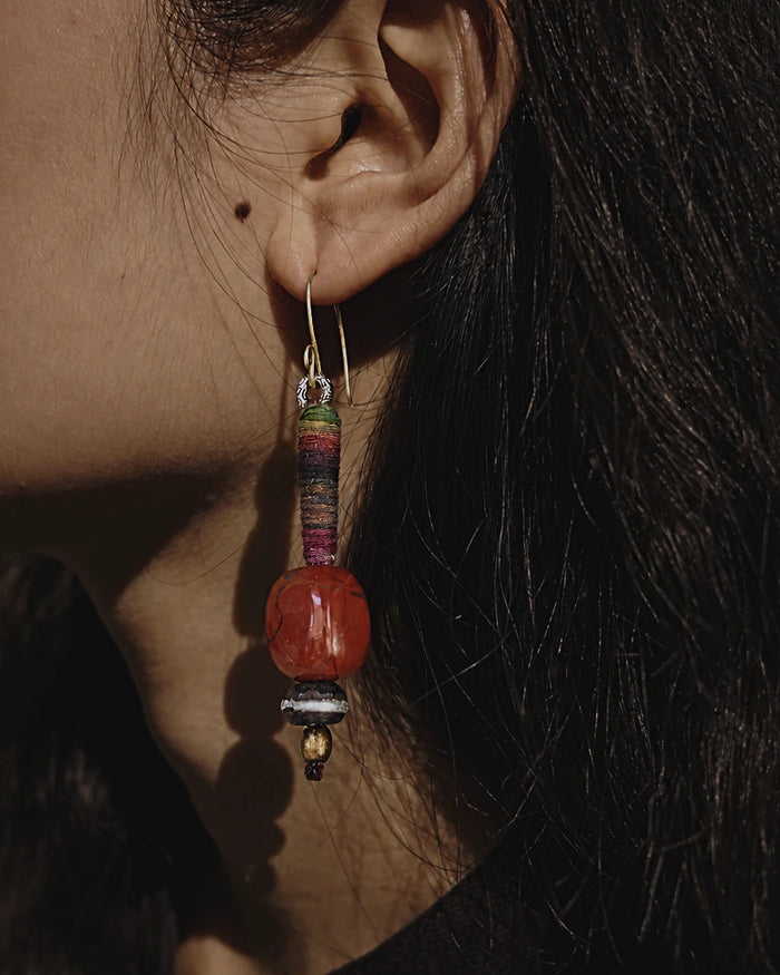 The Redthread #52: Red jasper earring worn in profile with dark clothing