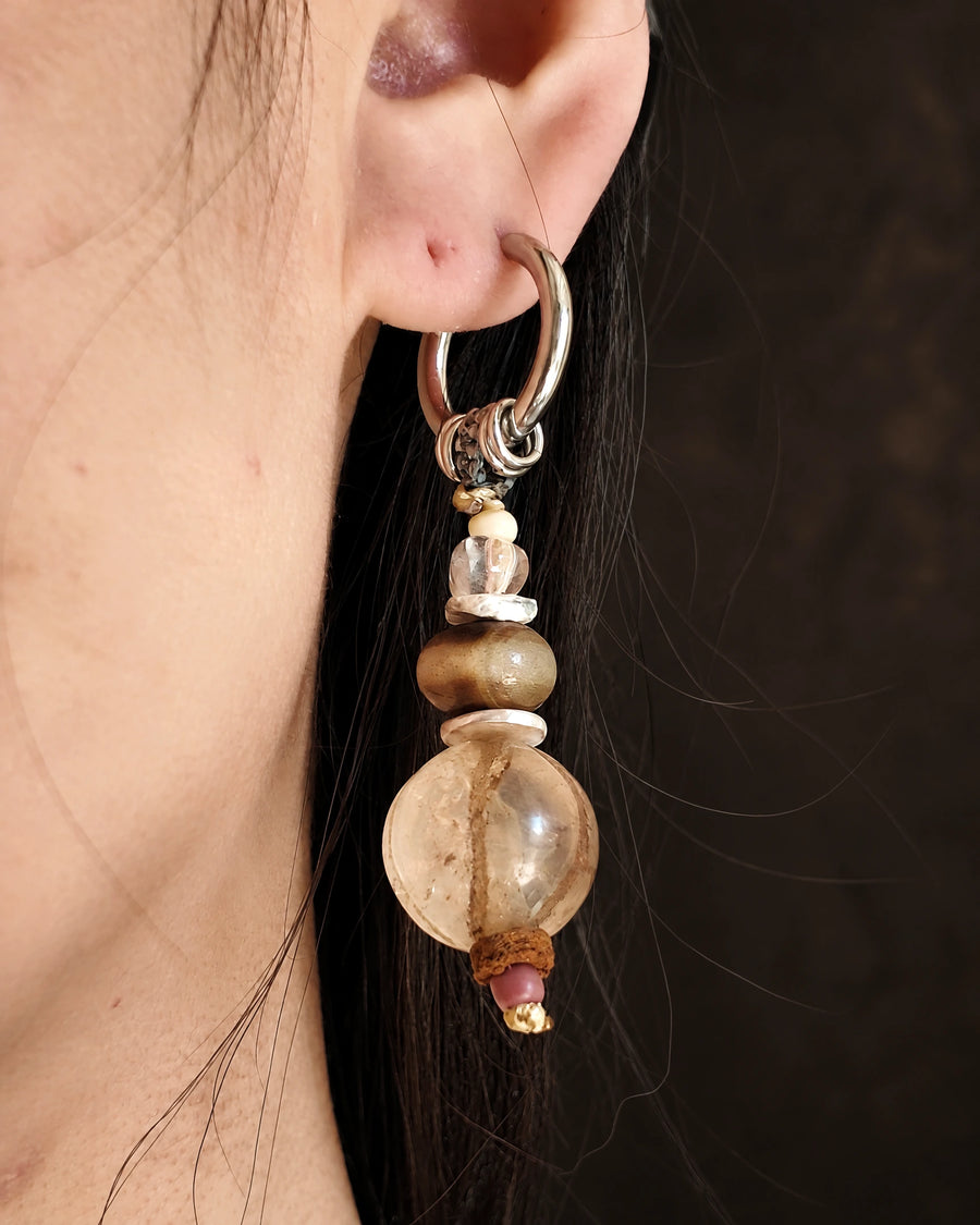 The Stillwater #55: Quartz and agate earring worn in profile, showing the full drop