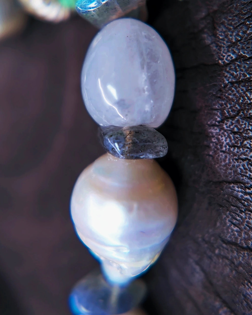 Macro view of a baroque pearl, blue moonstone and labradorite spacer on The Threshold #36