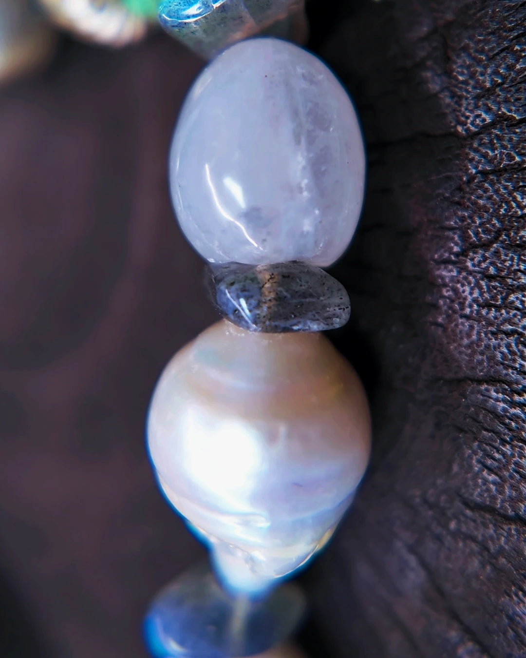 Macro view of a baroque pearl, blue moonstone and labradorite spacer on The Threshold #36