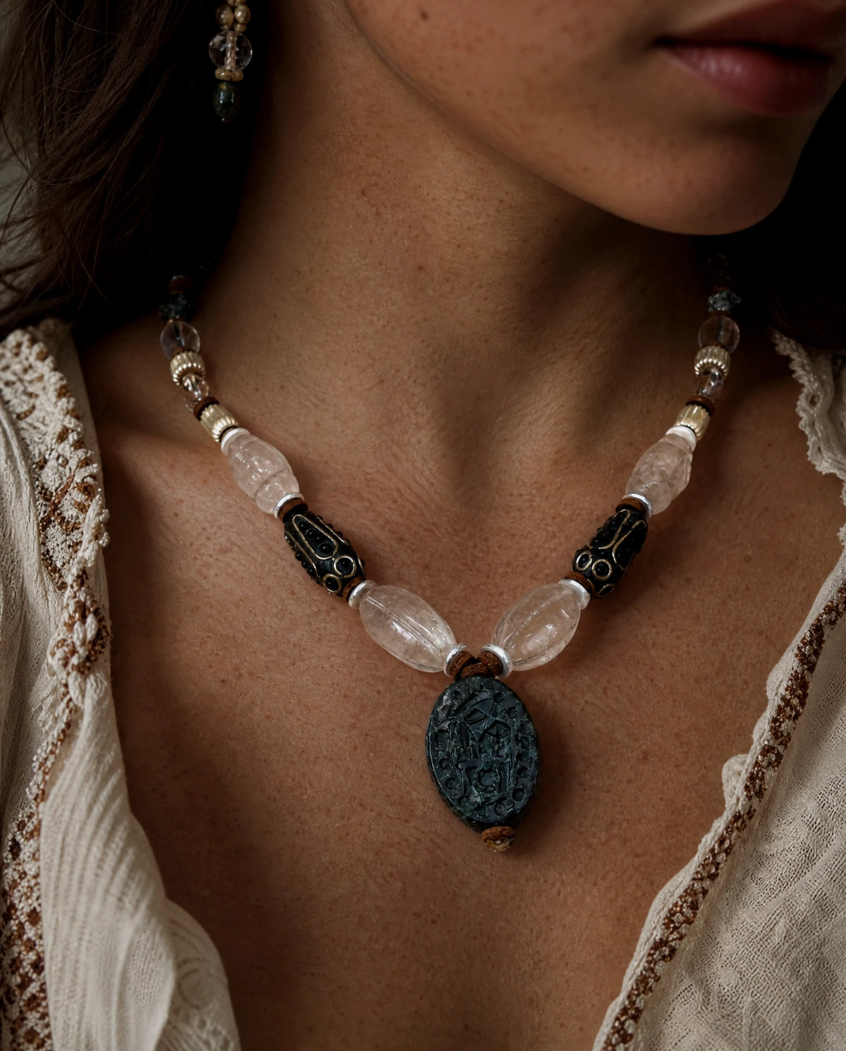 The Waymark #49: green jasper pendant and quartz necklace worn with a cream embroidered neckline