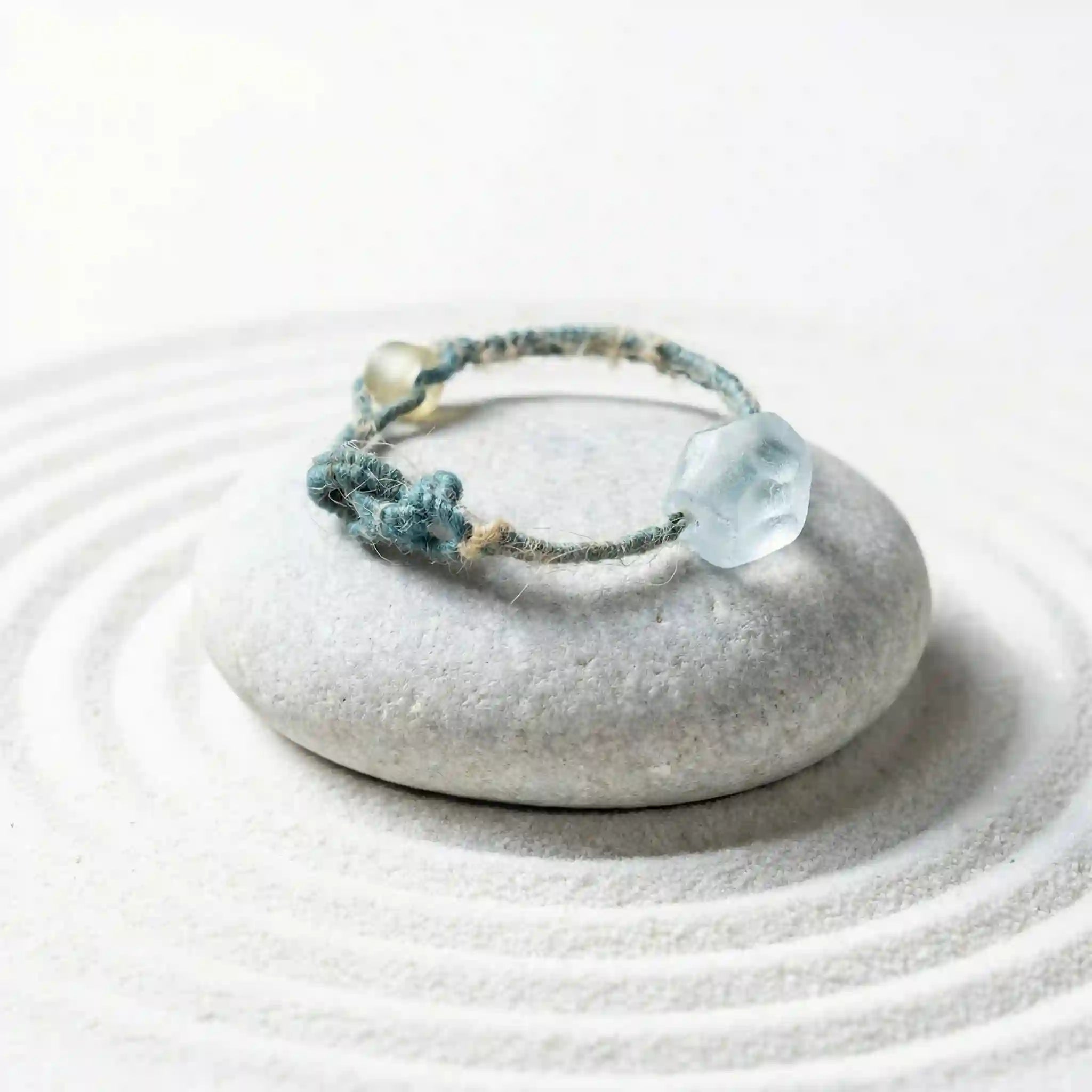 Energy bracelet with a patina glass bead on a white background