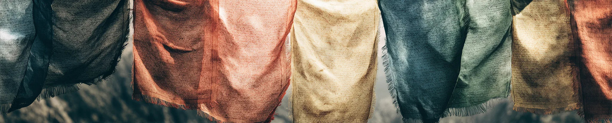 Soft woven prayer flags moving in the light